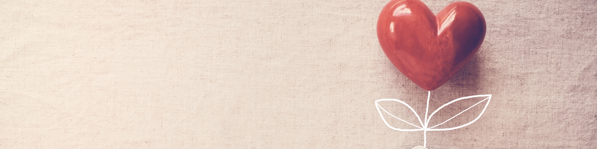 Penge i et glas med et hjerte over 